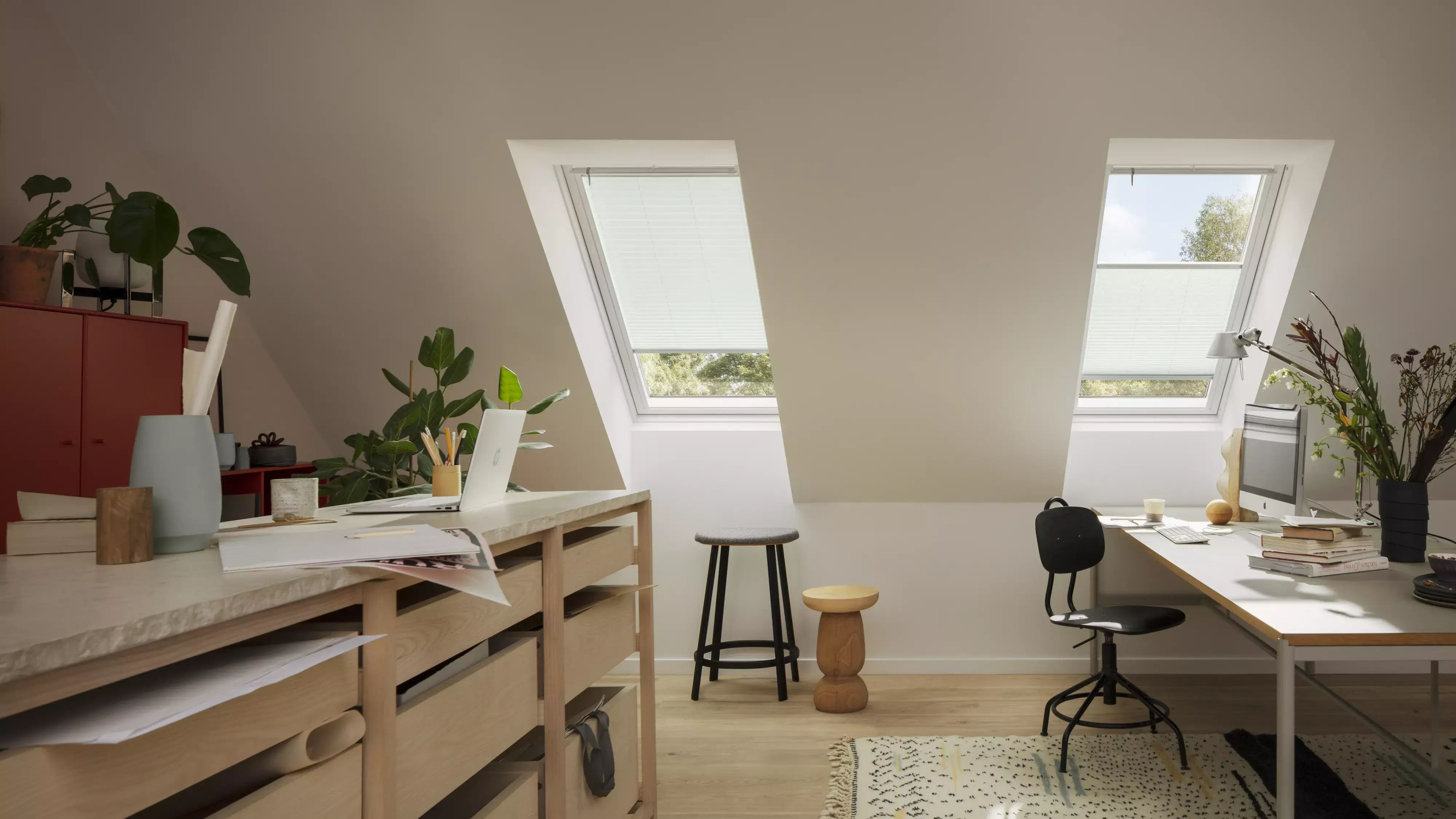 VELUX translucent pleated blind for roof windows installed in two VELUX roof windows seen from the inside.